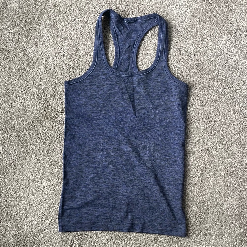 Lululemon Purple/black size 4 swiftly.
